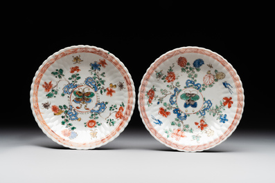 A pair of Chinese famille verte cafe-au-lait-ground cups and saucers, Kangxi