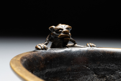 A rare Chinese bronze narcissus basin-shaped censer with dragon handles, Xuande mark, 17th C.