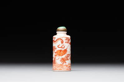 A Chinese jade carving, a tortoiseshell card holder and an iron-red snuff bottle, 19th C.