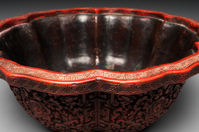 A Chinese red cinnabar lacquer jardiniere with floral design, Yongzheng/Qianlong