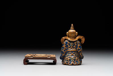 A Chinese gilt and champlev&eacute; enamelled bronze Bodhisattva on a carved stone stand, Qing
