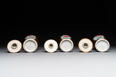 A Chinese capucin-brown-ground famille rose garniture of five vases with floral design, Qianlong