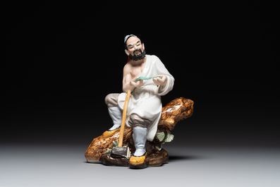 A Chinese polychrome sculpture of a lumberjack, Jingdezheng mark, 20th C.