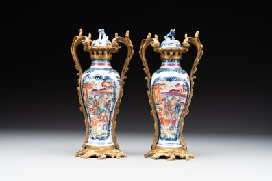 A pair of Chinese Canton famille rose 'mandarin subject' vases with gilt bronze mounts, Qianlong
