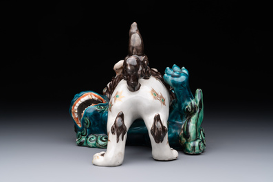 A Japanese polychrome-glazed group of playing Buddhist lions, 18/19th C.