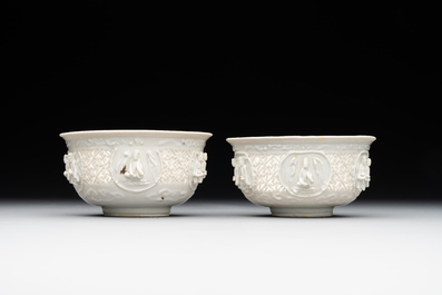 A pair of rare Chinese reticulated white-glazed biscuit 'Eight Immortals and Shoulao' bowls, Wanli