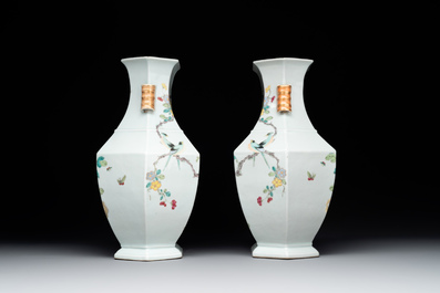 A pair of hexagonal Chinese famille rose 'hu' vases with floral design, Qianlong/Jiaqing