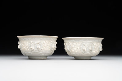 A pair of rare Chinese reticulated white-glazed biscuit 'Eight Immortals and Shoulao' bowls, Wanli