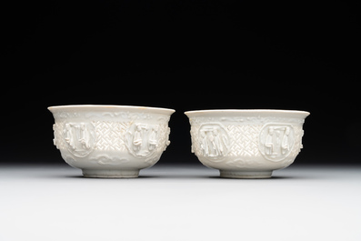 A pair of rare Chinese reticulated white-glazed biscuit 'Eight Immortals and Shoulao' bowls, Wanli