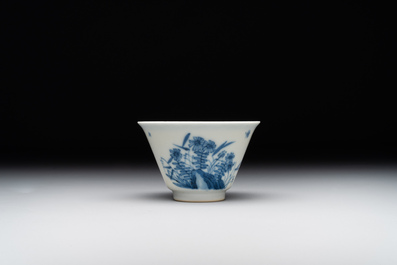 A Chinese blue and white 'erotic' cup and saucer, Kangxi