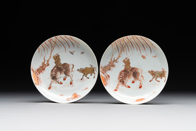 A pair of Chinese iron-red saucers and two plates, Kangxi/Yongzheng