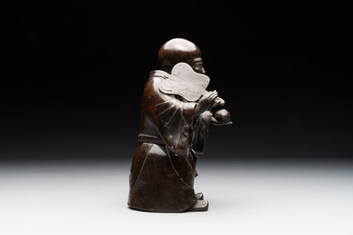 A Chinese bronze vase and a Taoist figure-shaped incense burner, Ming
