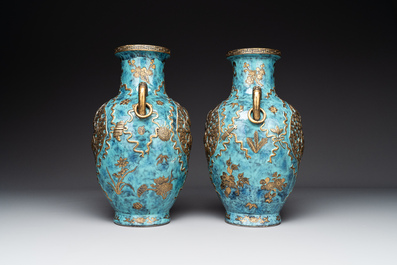 A pair of Chinese robin's egg and faux bronze-glazed 'hu' vases, Qianlong mark, 19th C.