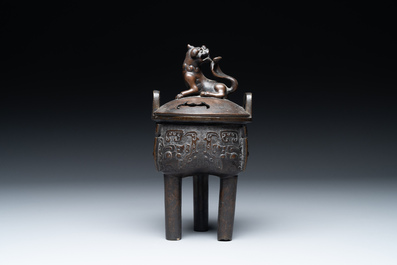 A fine Chinese bronze censer and cover with a Buddhist lion, 'ding 鼎', Xuande Mark, Ming
