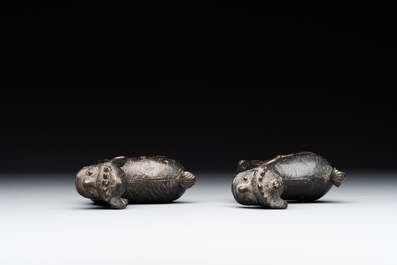 A pair of Chinese bronze mythical creatures and two ewers, Ming