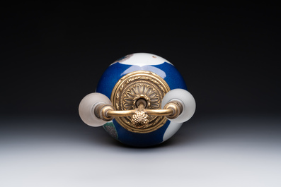 A Chinese famille verte  powder-blue-ground 'mythical animal' vase with gilt bronze lamp mounts, 19th C.