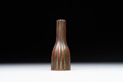 A rare Chinese ribbed bronze flower arranging vase, Ming