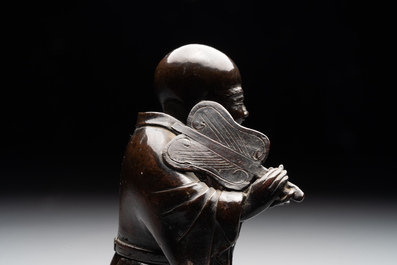A Chinese bronze vase and a Taoist figure-shaped incense burner, Ming