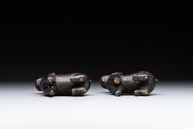 A pair of Chinese bronze mythical creatures and two ewers, Ming