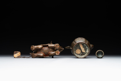 A pair of Chinese bronze mythical creatures and two ewers, Ming