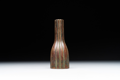 A rare Chinese ribbed bronze flower arranging vase, Ming
