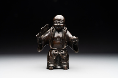 A Chinese bronze vase and a Taoist figure-shaped incense burner, Ming