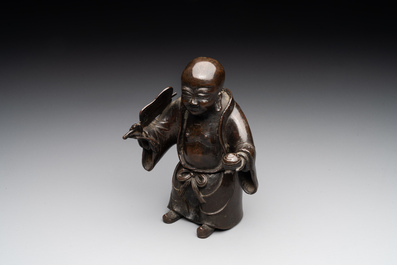 A Chinese bronze vase and a Taoist figure-shaped incense burner, Ming