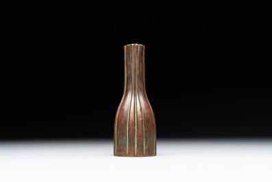 A rare Chinese ribbed bronze flower arranging vase, Ming