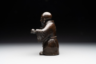 A Chinese bronze vase and a Taoist figure-shaped incense burner, Ming
