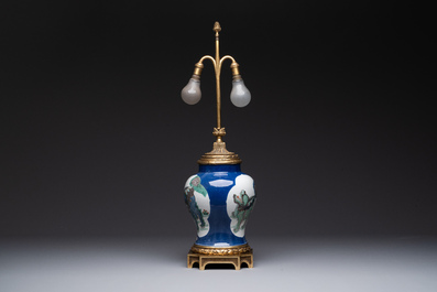 A Chinese famille verte  powder-blue-ground 'mythical animal' vase with gilt bronze lamp mounts, 19th C.