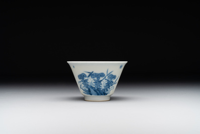 A Chinese blue and white 'erotic' cup and saucer, Kangxi