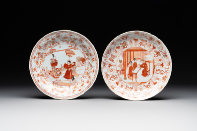 A pair of Chinese iron-red saucers and two plates, Kangxi/Yongzheng