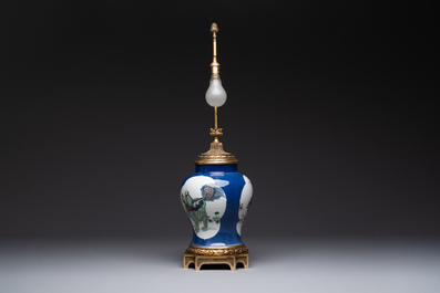 A Chinese famille verte  powder-blue-ground 'mythical animal' vase with gilt bronze lamp mounts, 19th C.