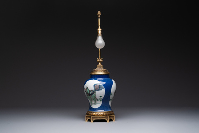 A Chinese famille verte  powder-blue-ground 'mythical animal' vase with gilt bronze lamp mounts, 19th C.