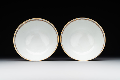 A pair of Chinese armorial famille rose cups and saucers with the arms of Tyndall for the English market and two monogrammed bowls, Qianlong
