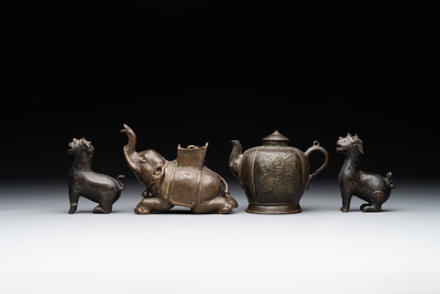 A pair of Chinese bronze mythical creatures and two ewers, Ming