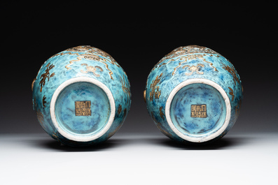 A pair of Chinese robin's egg and faux bronze-glazed 'hu' vases, Qianlong mark, 19th C.