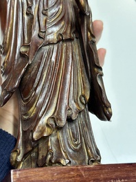 A Chinese partly gilt and lacquered wooden sculpture of Guanyin, Ming