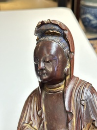 A Chinese partly gilt and lacquered wooden sculpture of Guanyin, Ming