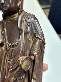 A Chinese partly gilt and lacquered wooden sculpture of Guanyin, Ming