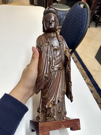 A Chinese partly gilt and lacquered wooden sculpture of Guanyin, Ming