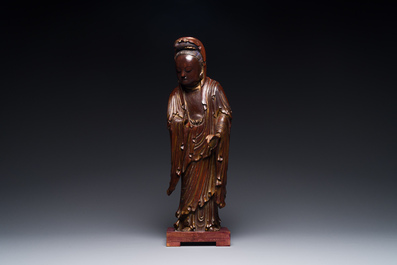 A Chinese partly gilt and lacquered wooden sculpture of Guanyin, Ming