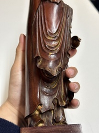 A Chinese partly gilt and lacquered wooden sculpture of Guanyin, Ming