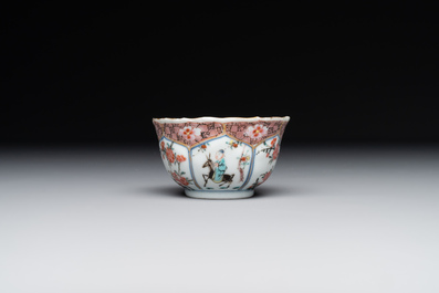 A Chinese famille rose cup and saucer with figures and animals, Yongzheng