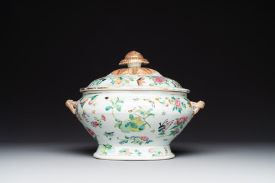 A Chinese Canton famille rose covered tureen on stand with flowers, fruits and insects, 19th C.