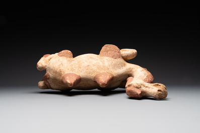 A pair of Chinese polychrome-painted terracotta camels with saddles, Tang