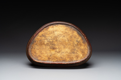 A large Sino-Tibetan gilt bronze Buddha on wooden stand, Ming