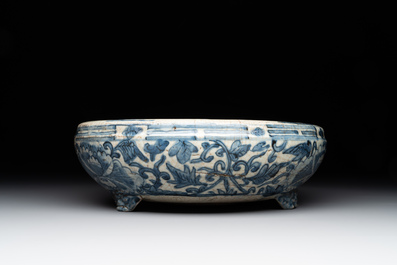 A Chinese Swatow blue and white crackle-glazed 'peonies and trigrams' tripod censer, Ming