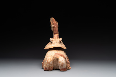 A pair of Chinese polychrome-painted terracotta camels with saddles, Tang