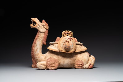 A pair of Chinese polychrome-painted terracotta camels with saddles, Tang